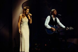 Céline Dion joins Barry Gibb of the Bee Gees on stage during the group's 1997 One Night Only concert at the MGM Grand in Las Vegas. (© Neal Preston/CORBIS)